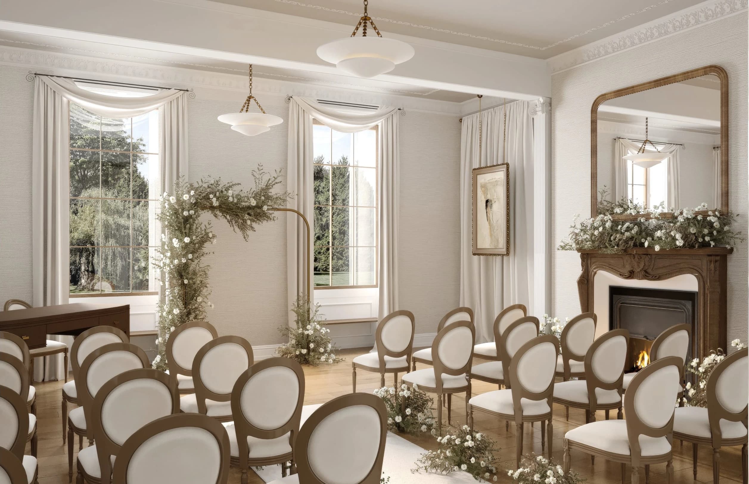 Ceremony-room inspiration with tall sash windows, an ivory floral arch, oval-backed chairs and a flower-dressed fireplace